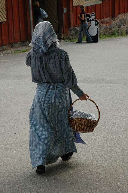 Skansen_lady_wearing_traditional_garments.jpg