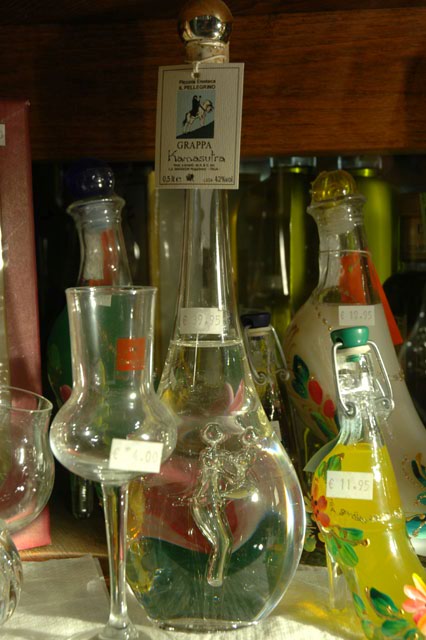 Grappa_and_some_other_goods_for_sale_in_a_local_store.jpg