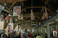 Old_school_market_with_meat_hanging_up.jpg