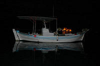 Boat_on_the_water_at_night.jpg