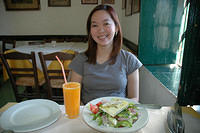 Charlotte_smiles_with_the_Greek_salad_and_fresh_OJ_jpg.jpg