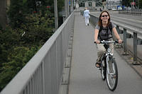 Charlotte_biking_over_the_bridge.jpg